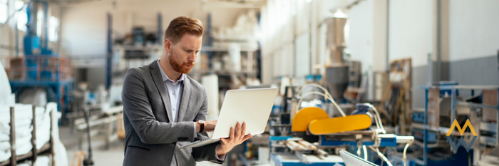 A man on laptop doing safety inspection